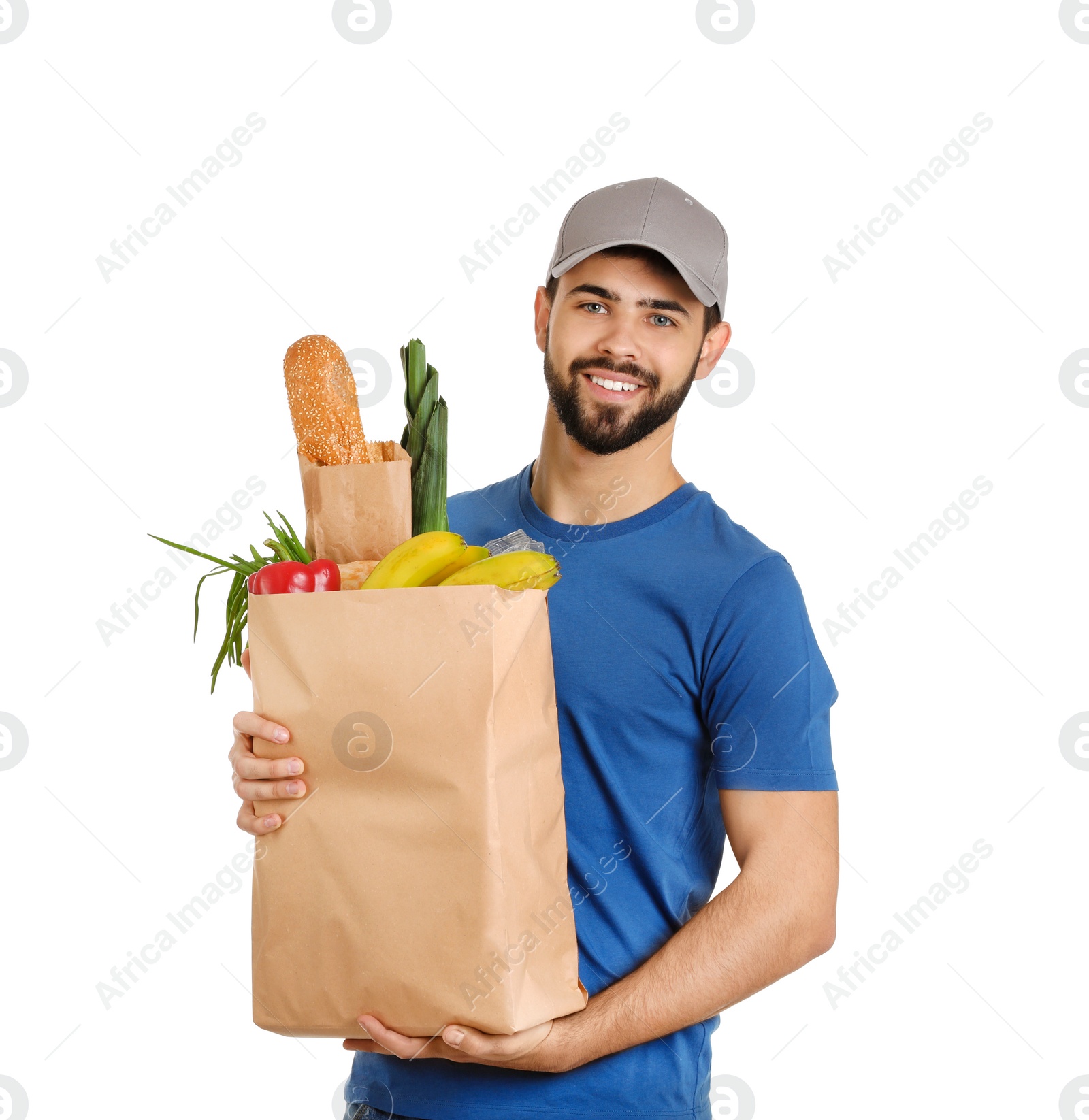 Photo of Man holding paper bag with fresh products on white background. Food delivery service