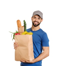 Photo of Man holding paper bag with fresh products on white background. Food delivery service