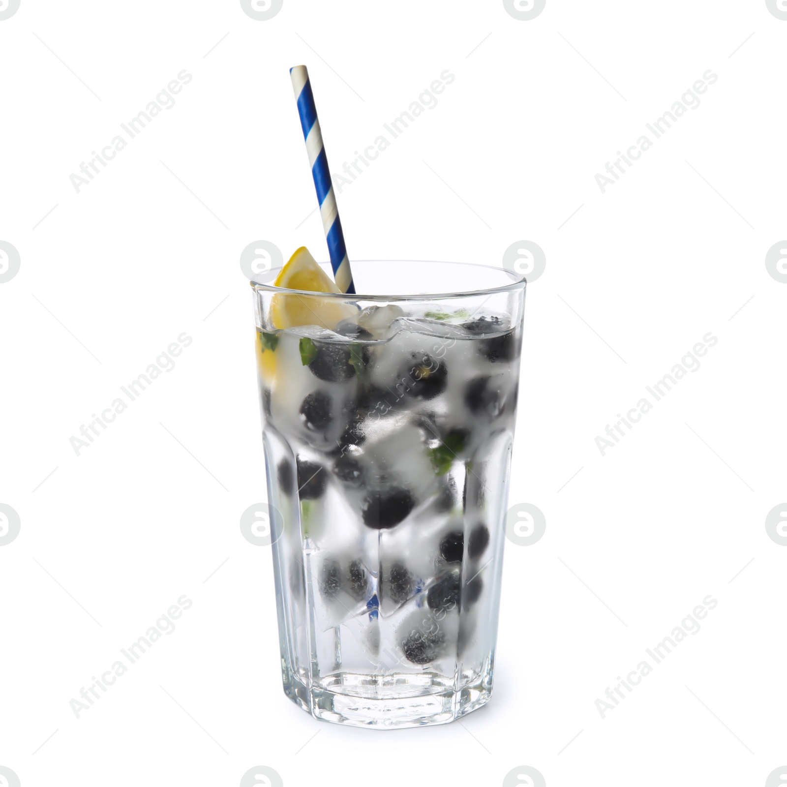 Photo of Glass of drink with blueberry ice cubes isolated on white