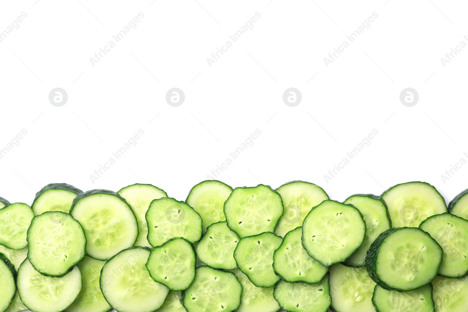 Photo of Slices of cucumbers on white background, top view