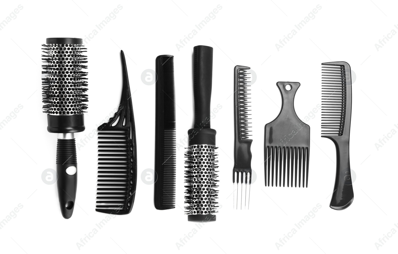 Photo of Set of modern hair combs and brushes isolated on white, top view