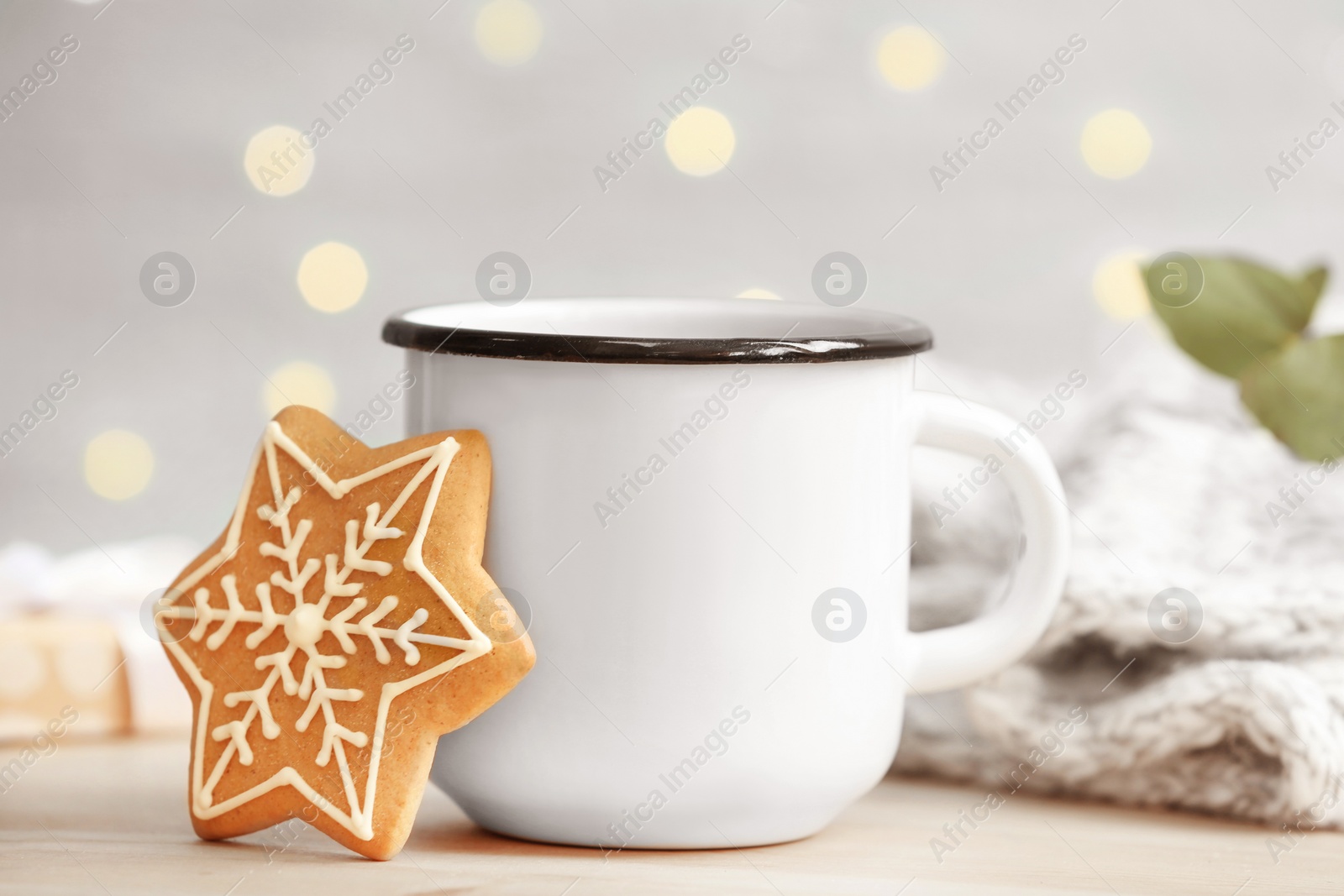 Photo of Composition with cup of hot winter drink and Christmas cookie on table. Cozy season