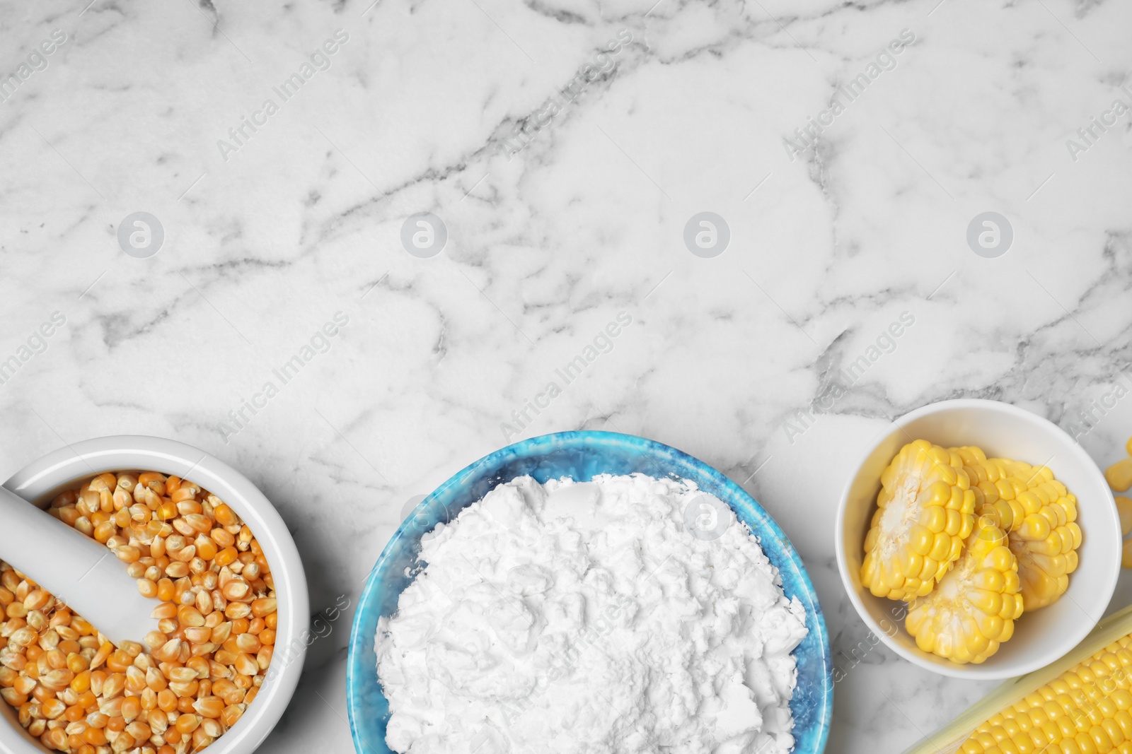 Photo of Flat lay composition with corn starch and space for text on marble background