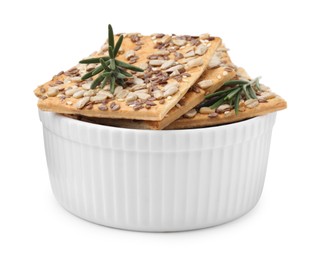 Photo of Cereal crackers with flax, sunflower, sesame seeds and rosemary in bowl isolated on white