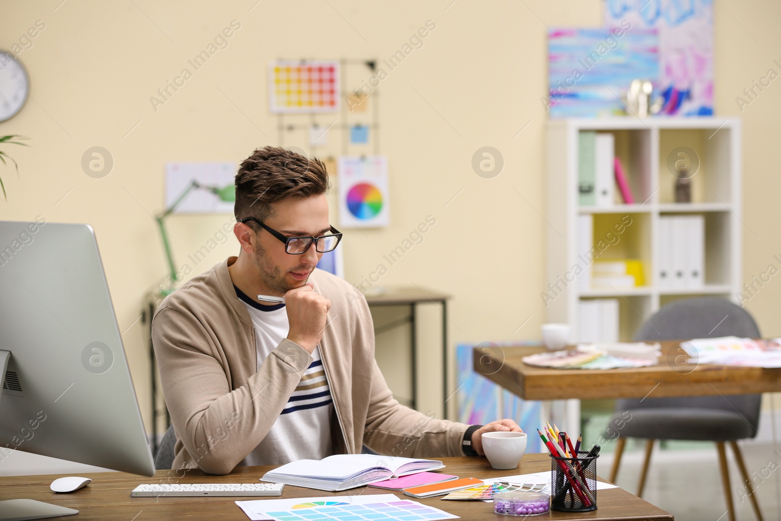 Photo of Professional interior designer at workplace in office