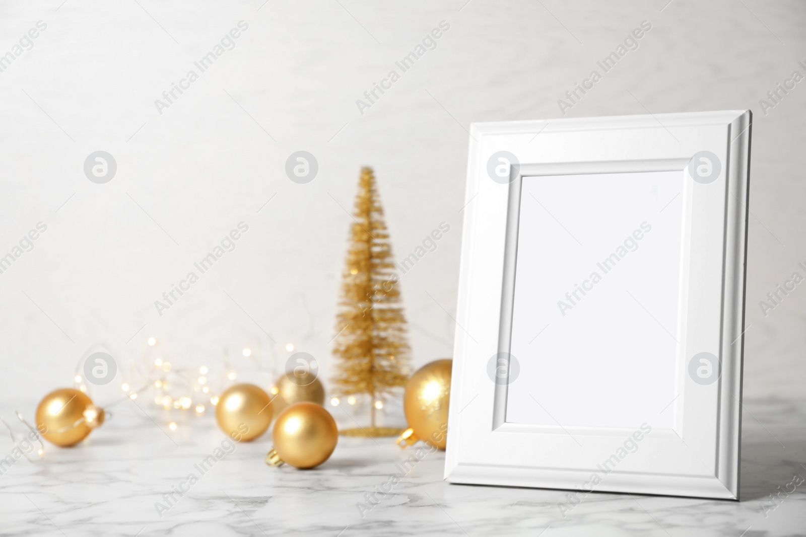 Photo of Empty frame and decor on table. Christmas countdown