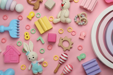 Photo of Different children's toys on pink background, flat lay
