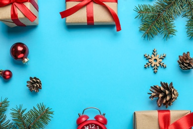 Frame of Christmas gifts on light blue background, flat lay with space for text. Boxing day