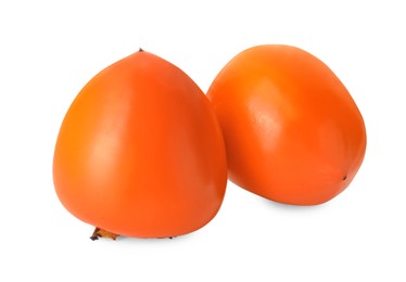 Delicious ripe juicy persimmons on white background