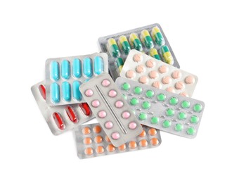 Photo of Blisters with different pills on white background, top view