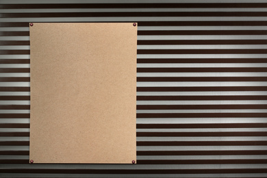 Image of Blank poster attached to striped wall. Space for design