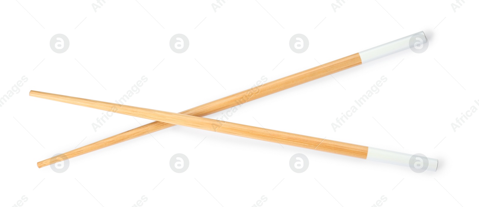 Photo of Pair of wooden chopsticks isolated on white, top view