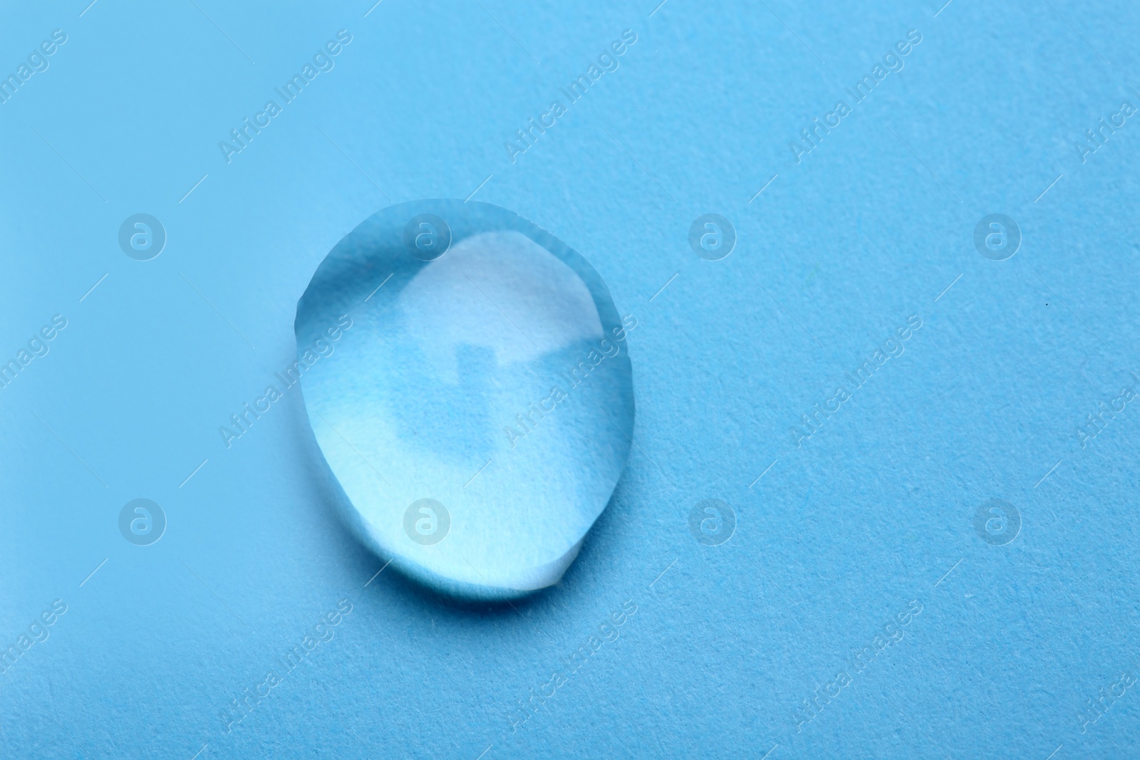 Photo of Water drop on color background, top view. Space for text