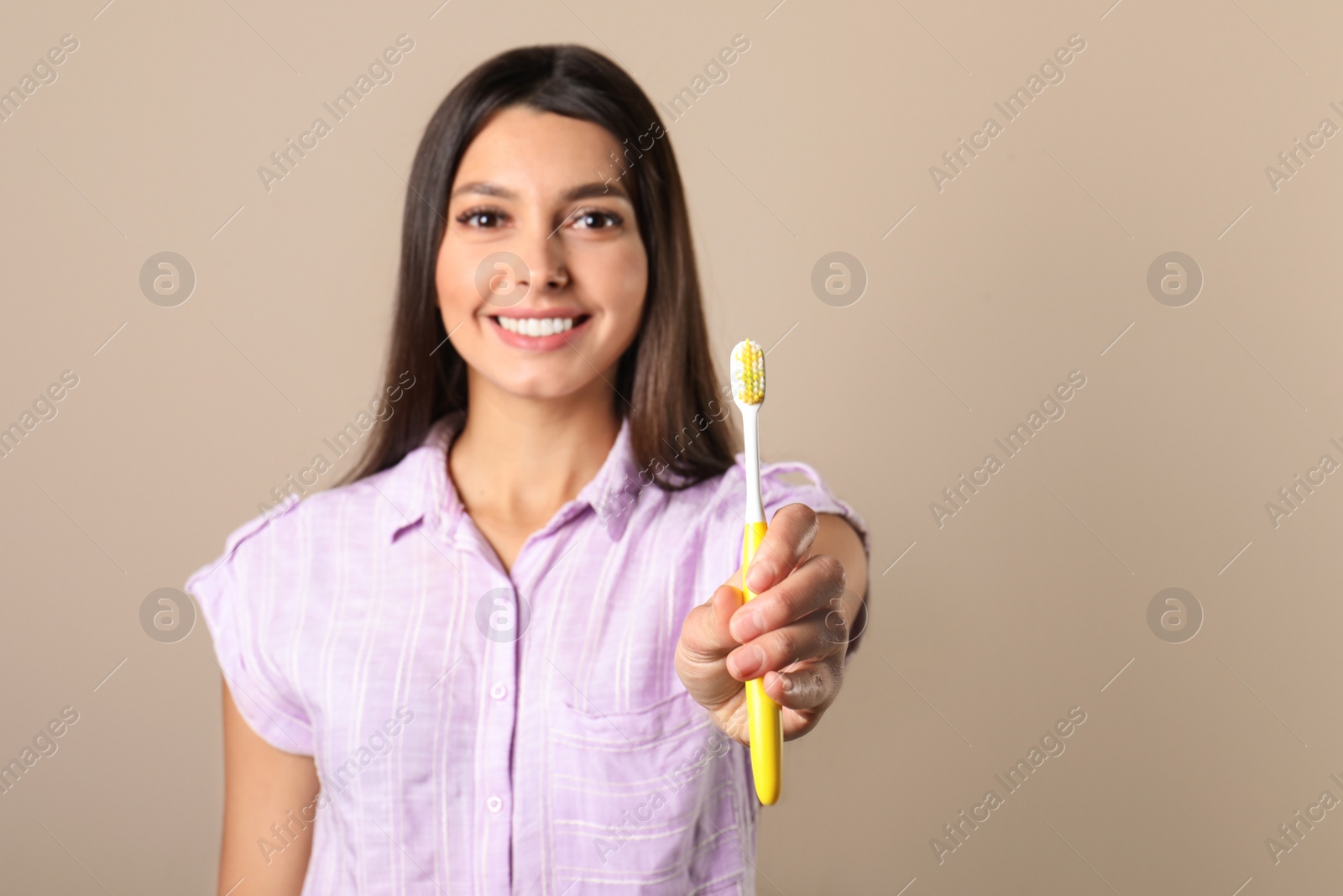 Photo of Young woman with toothbrush on color background, space for text. Teeth care