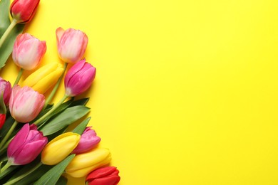 Photo of Beautiful colorful tulip flowers on yellow background, flat lay. Space for text