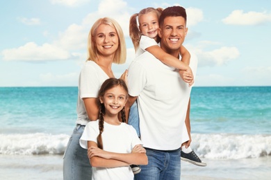 Image of Happy family on beach near sea. Summer vacation