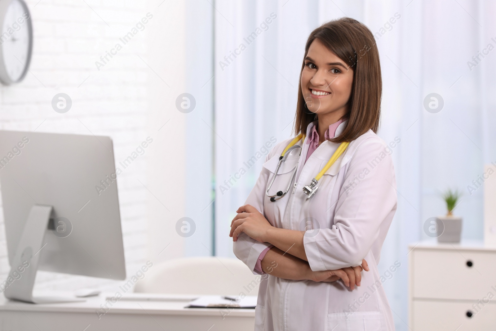 Photo of Portrait of pediatrician with stethoscope in clinic