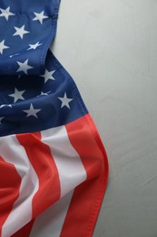 Flag of USA on light grey table, top view