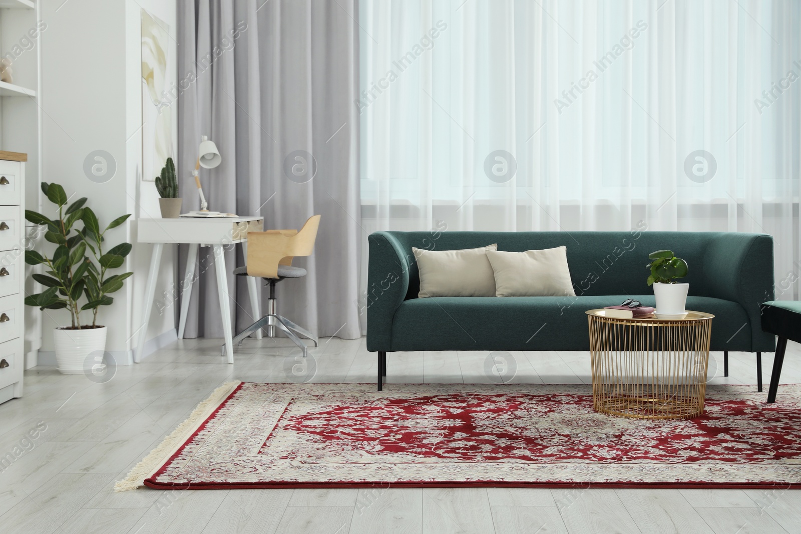 Photo of Stylish living room with beautiful carpet and furniture. Interior design