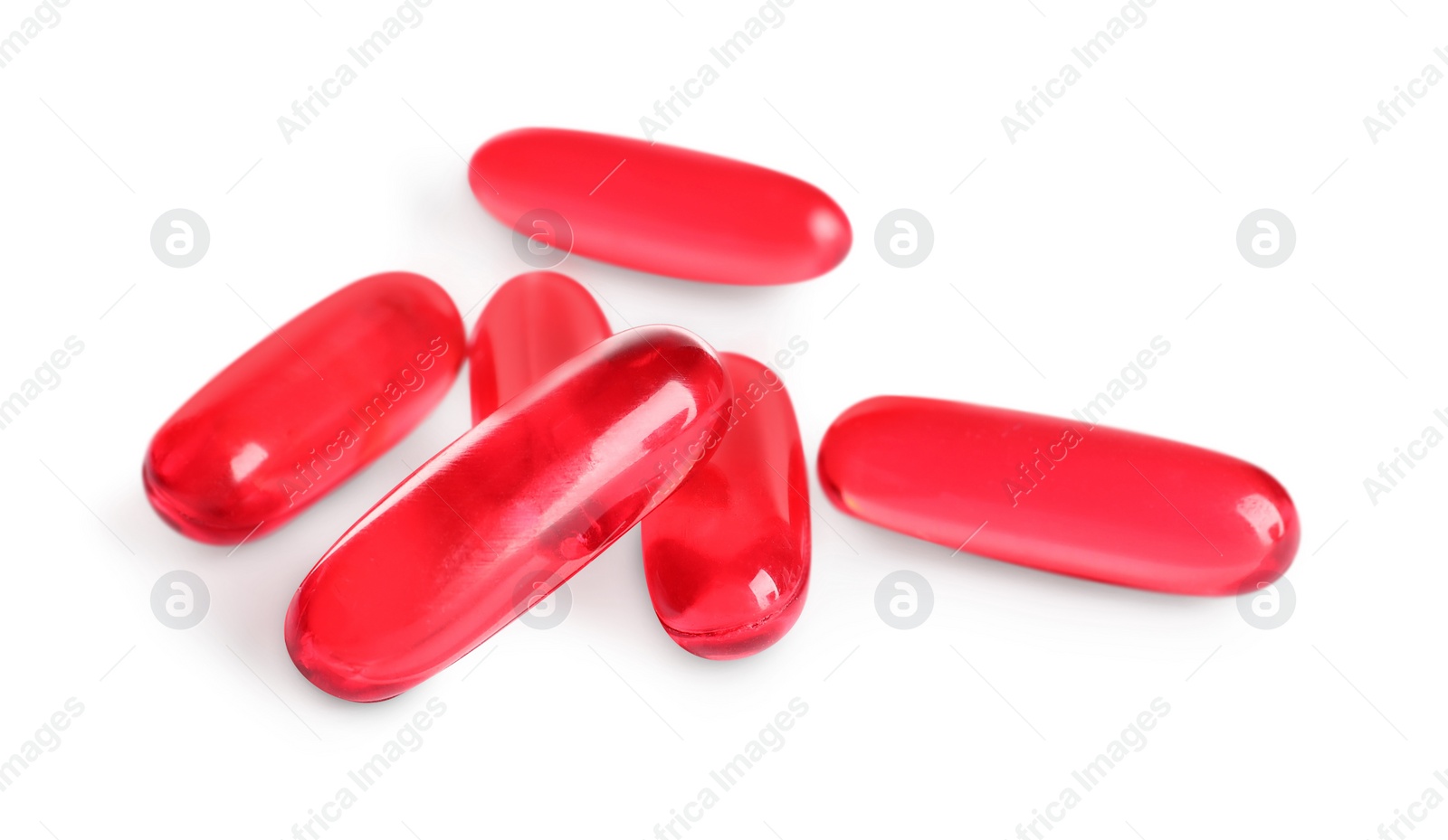 Photo of Many red pills isolated on white. Medicinal treatment