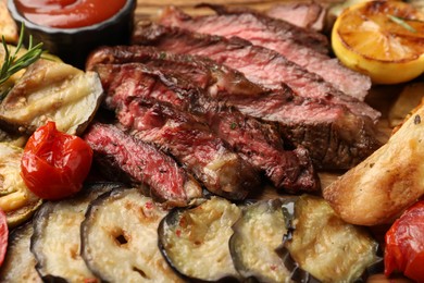 Delicious grilled beef with vegetables on table, closeup