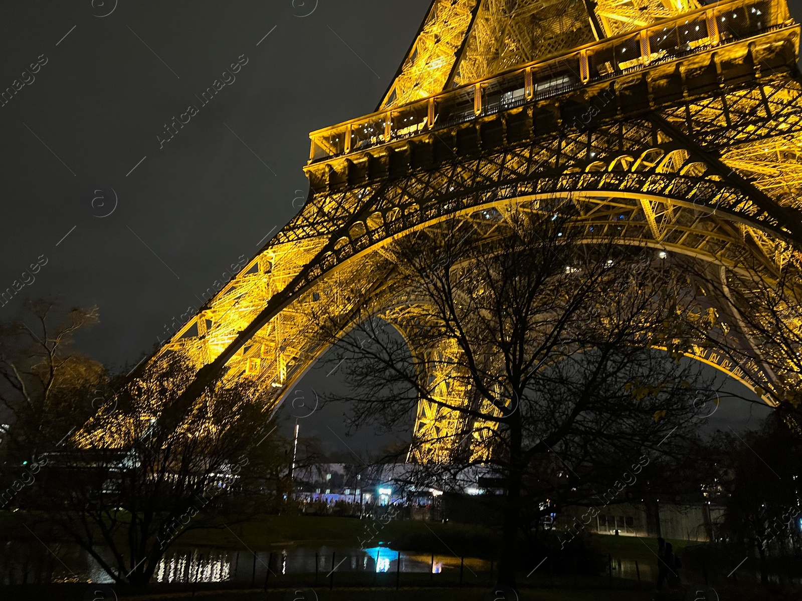 Photo of Beautiful illuminated Eiffel tower against night sky, low angle view