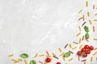 Beautiful composition with raw pasta on table, top view