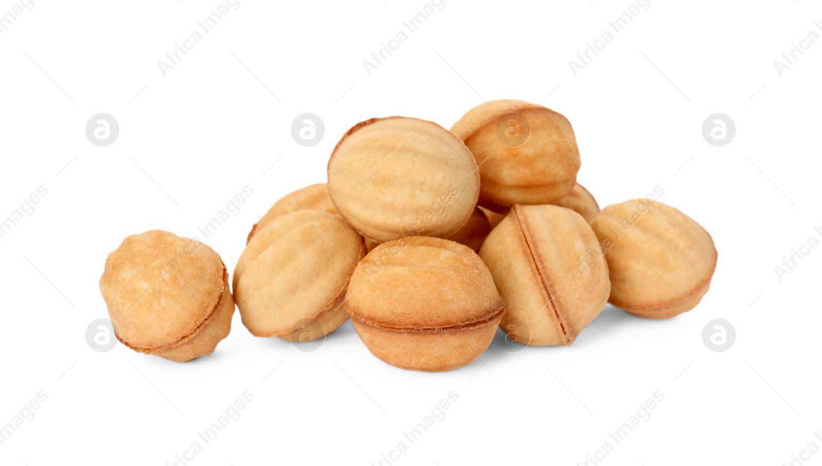 Photo of Delicious nut shaped cookies with boiled condensed milk on white background