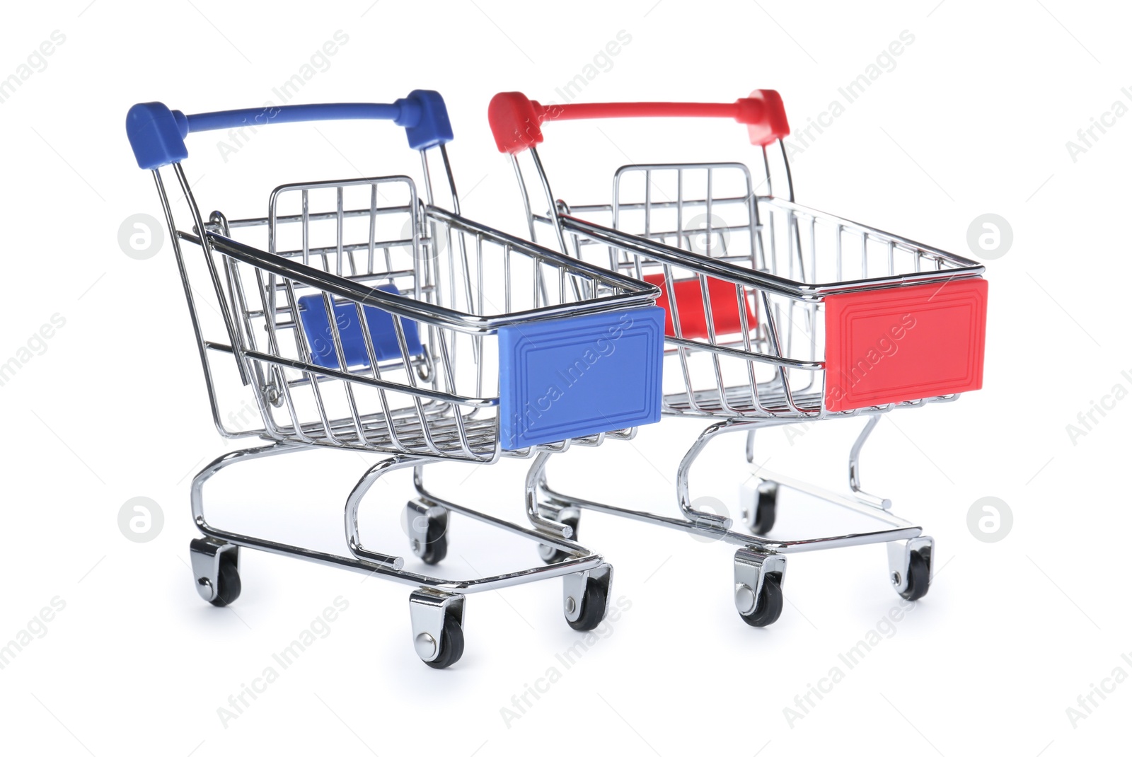 Photo of Empty metal shopping trolleys isolated on white