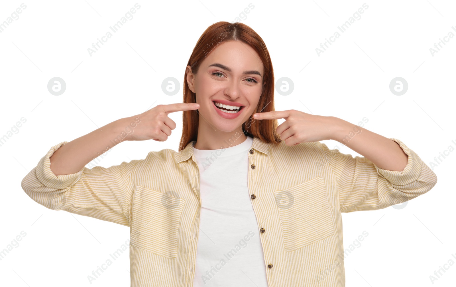 Photo of Beautiful woman showing her clean teeth and smiling on white background