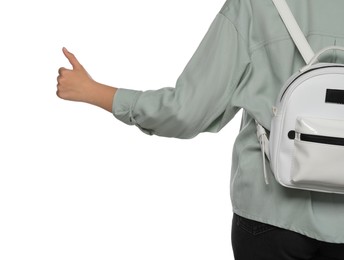 Woman with backpack hitchhiking on white background, closeup