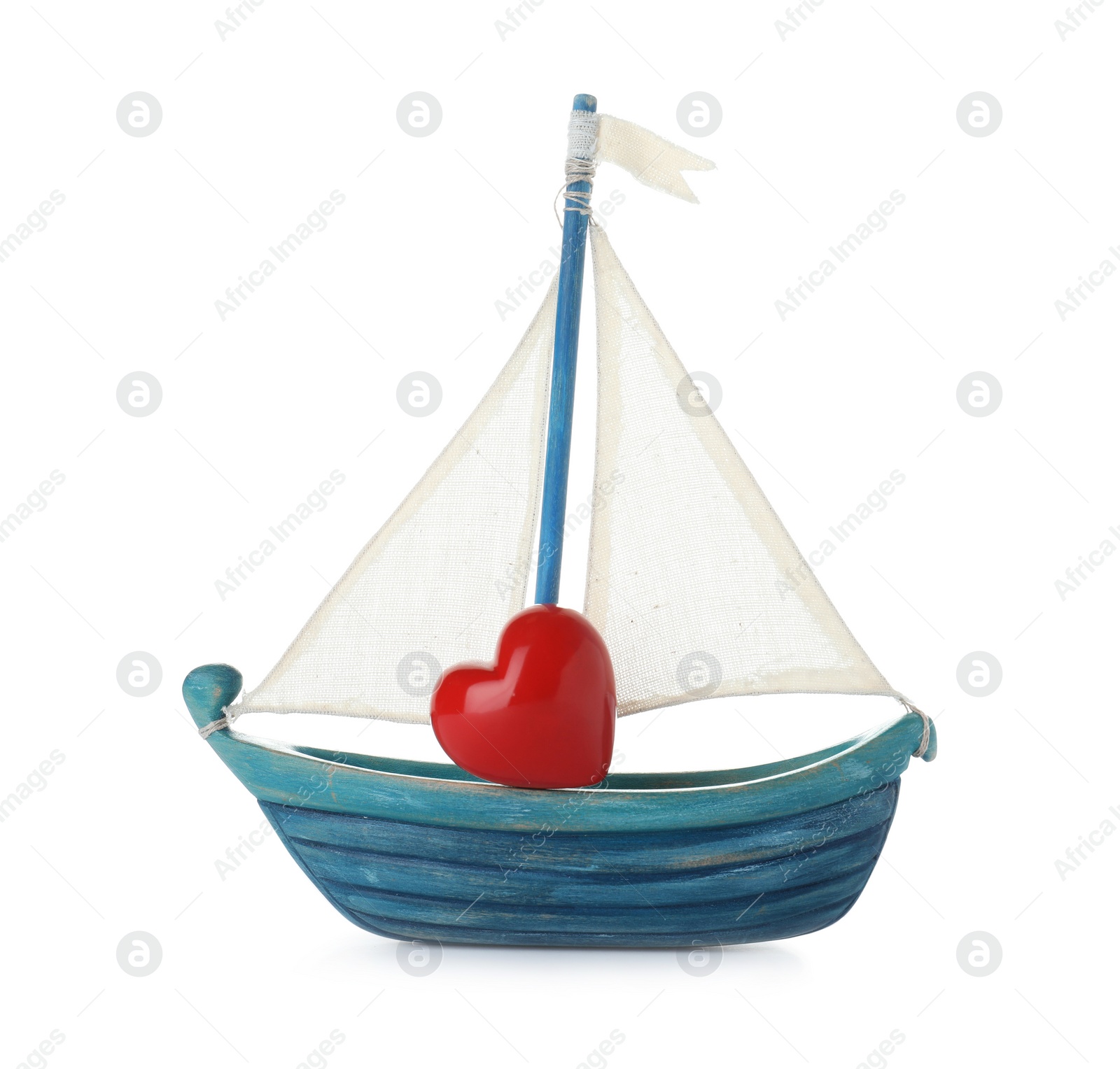 Photo of Toy boat with red heart on white background