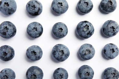 Flat lay composition with tasty blueberry on white background