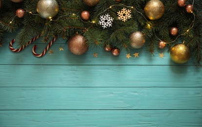 Photo of Christmas decoration on blue wooden background, flat lay. Space for text