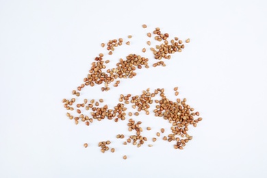 Uncooked buckwheat on white background, top view