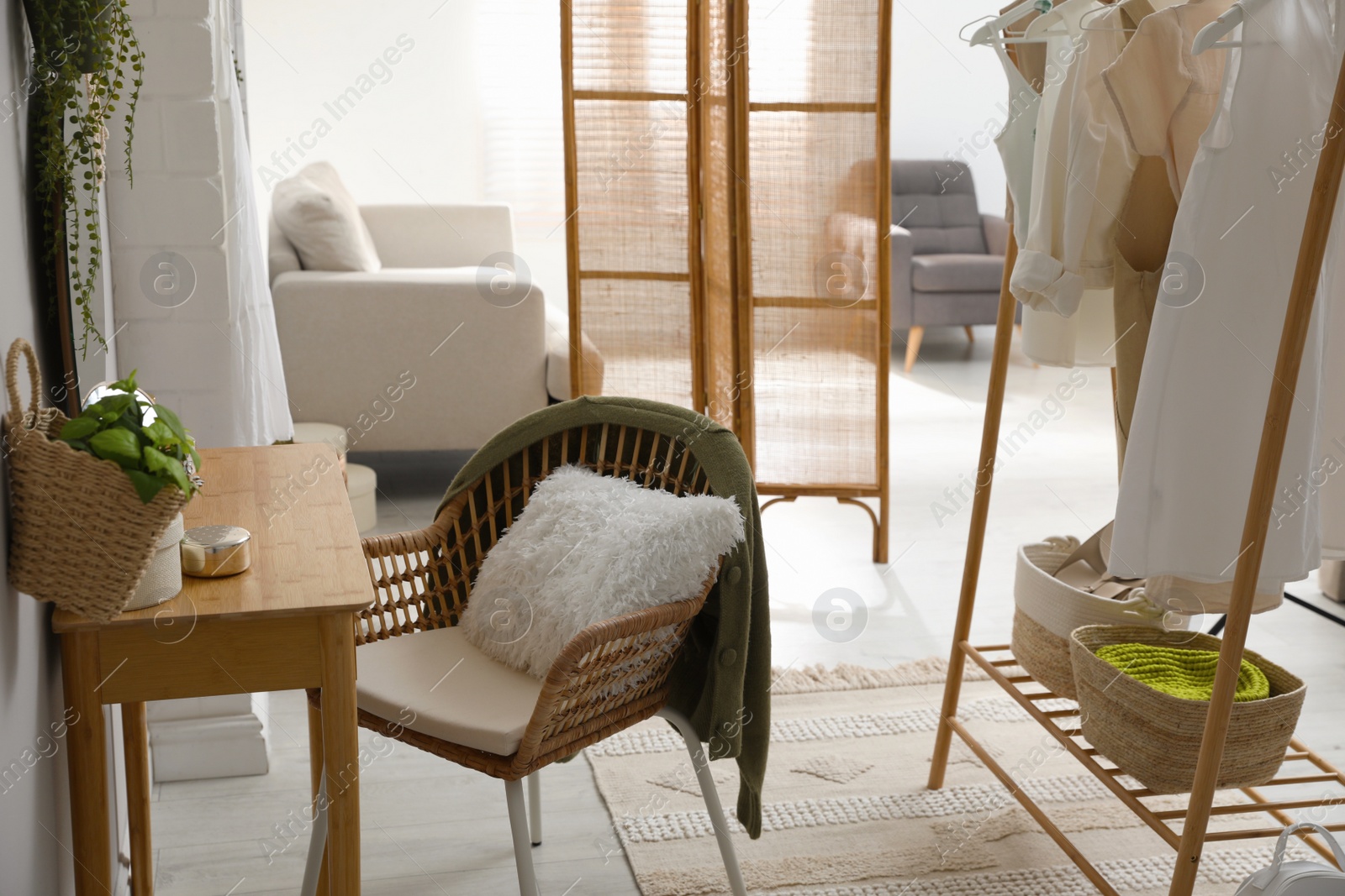 Photo of Wooden dressing table with decorative elements in room