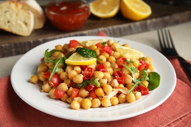 Photo of Delicious fresh chickpea salad served on table
