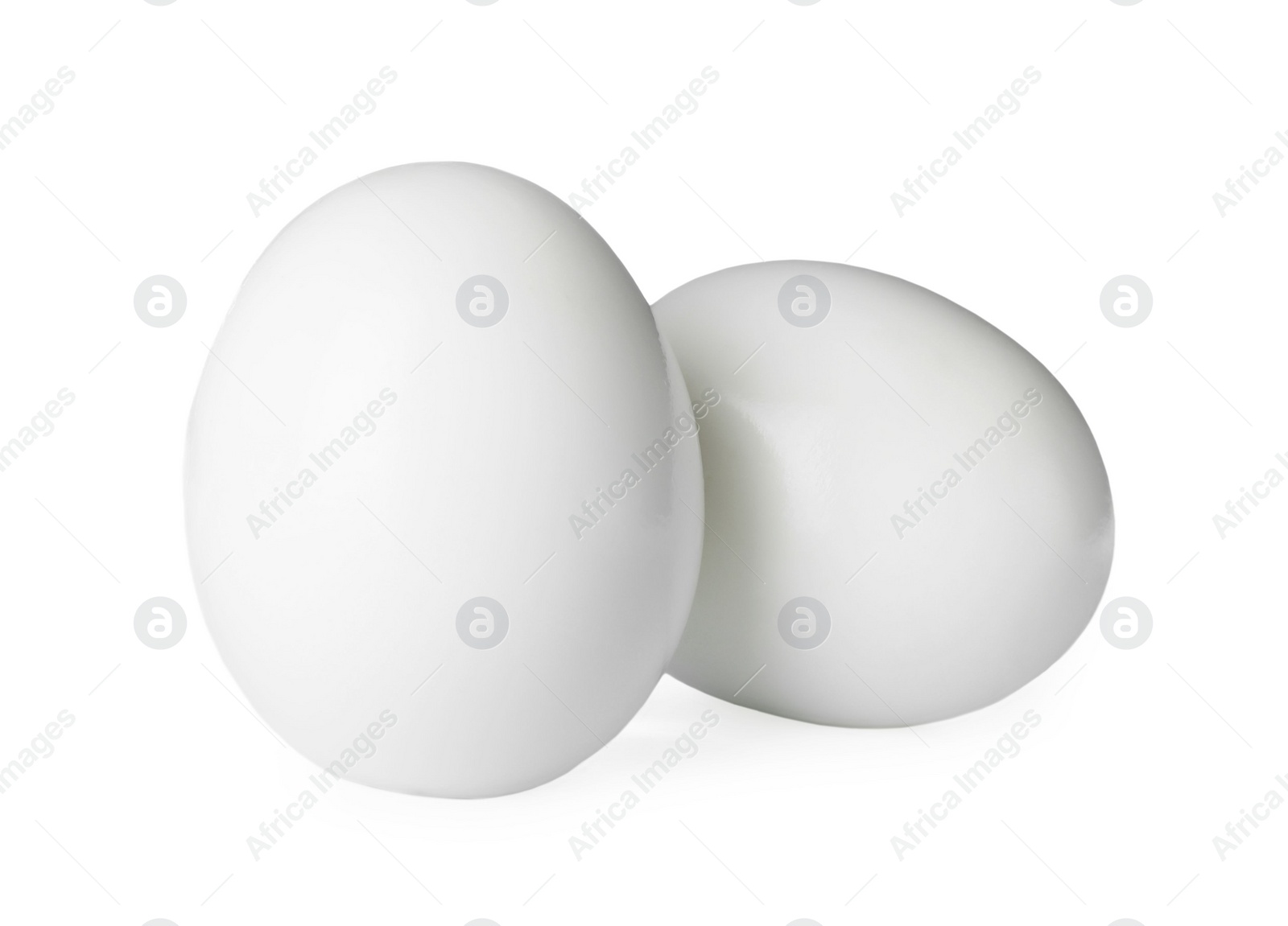 Photo of Fresh peeled boiled eggs on white background