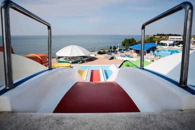 Photo of Colorful slides in water park on sunny day