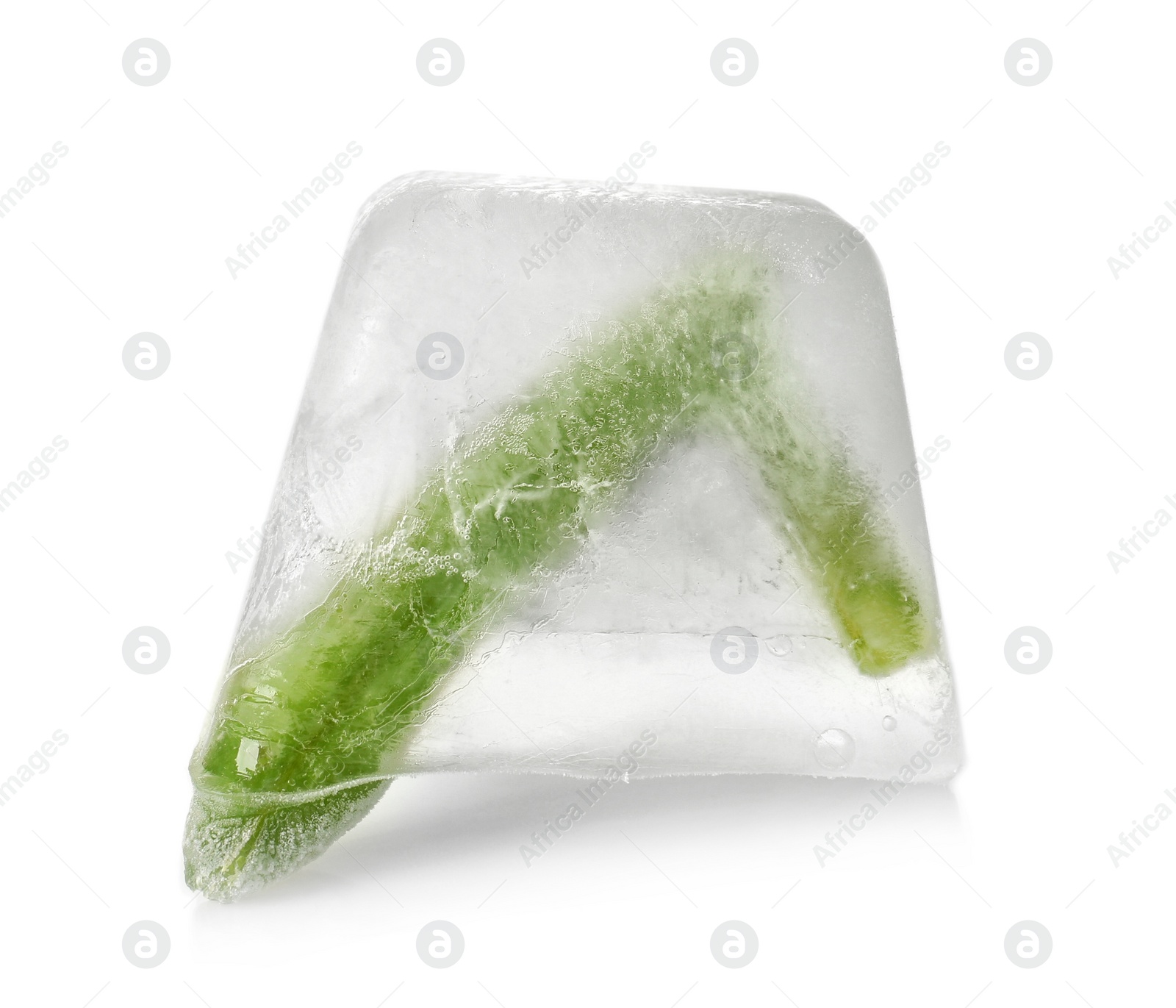 Photo of Fresh green beans in ice cube on white background. Frozen vegetables