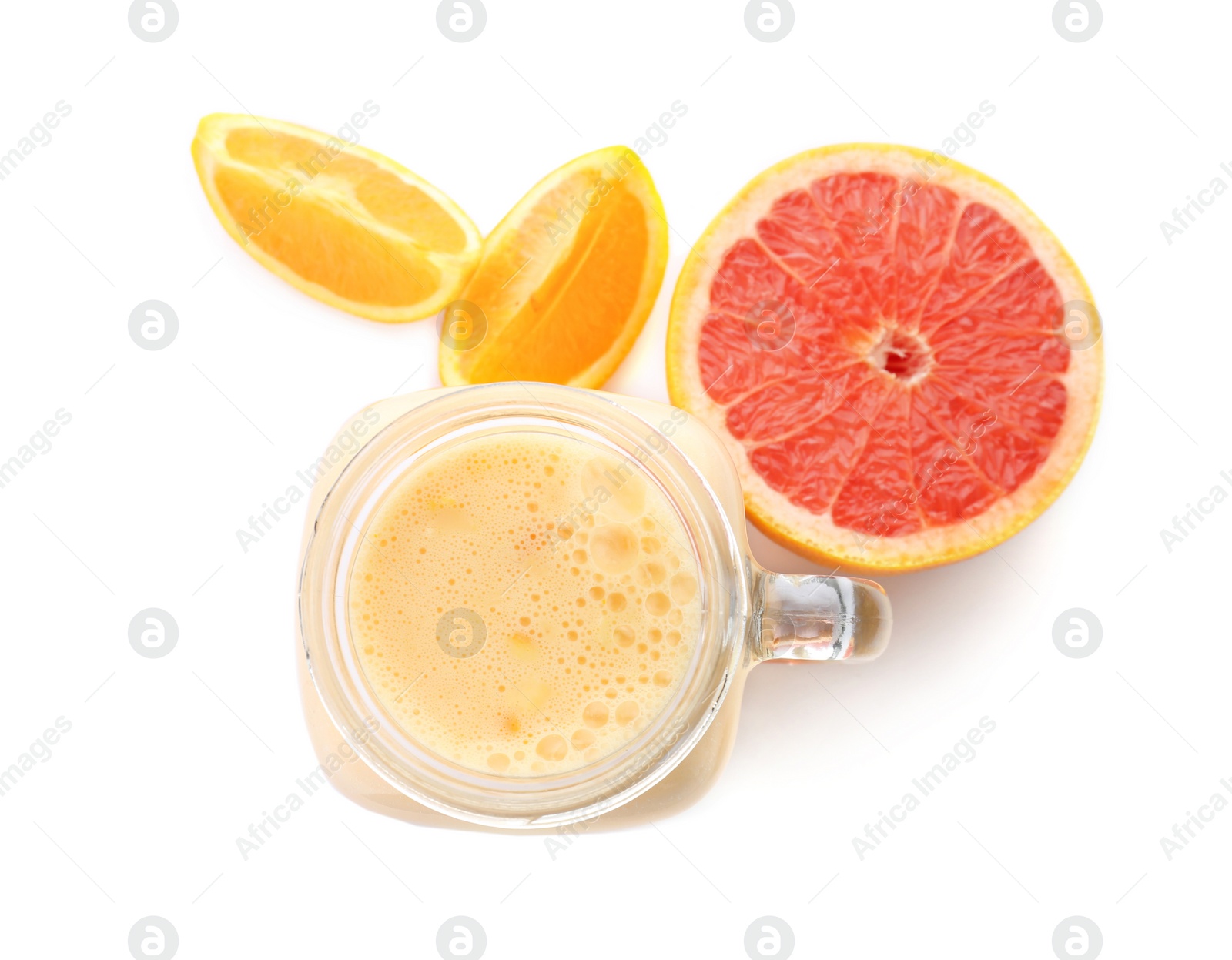 Photo of Mason jar with healthy detox smoothie and grapefruit on white background, top view