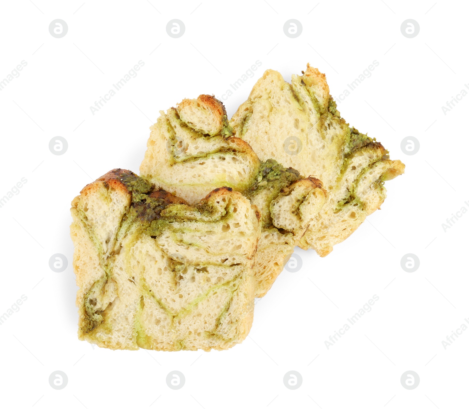 Photo of Slices of freshly baked pesto bread isolated on white, top view