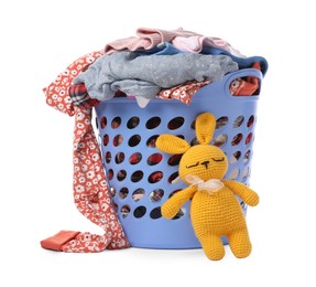 Photo of Laundry basket with baby clothes and soft toy isolated on white