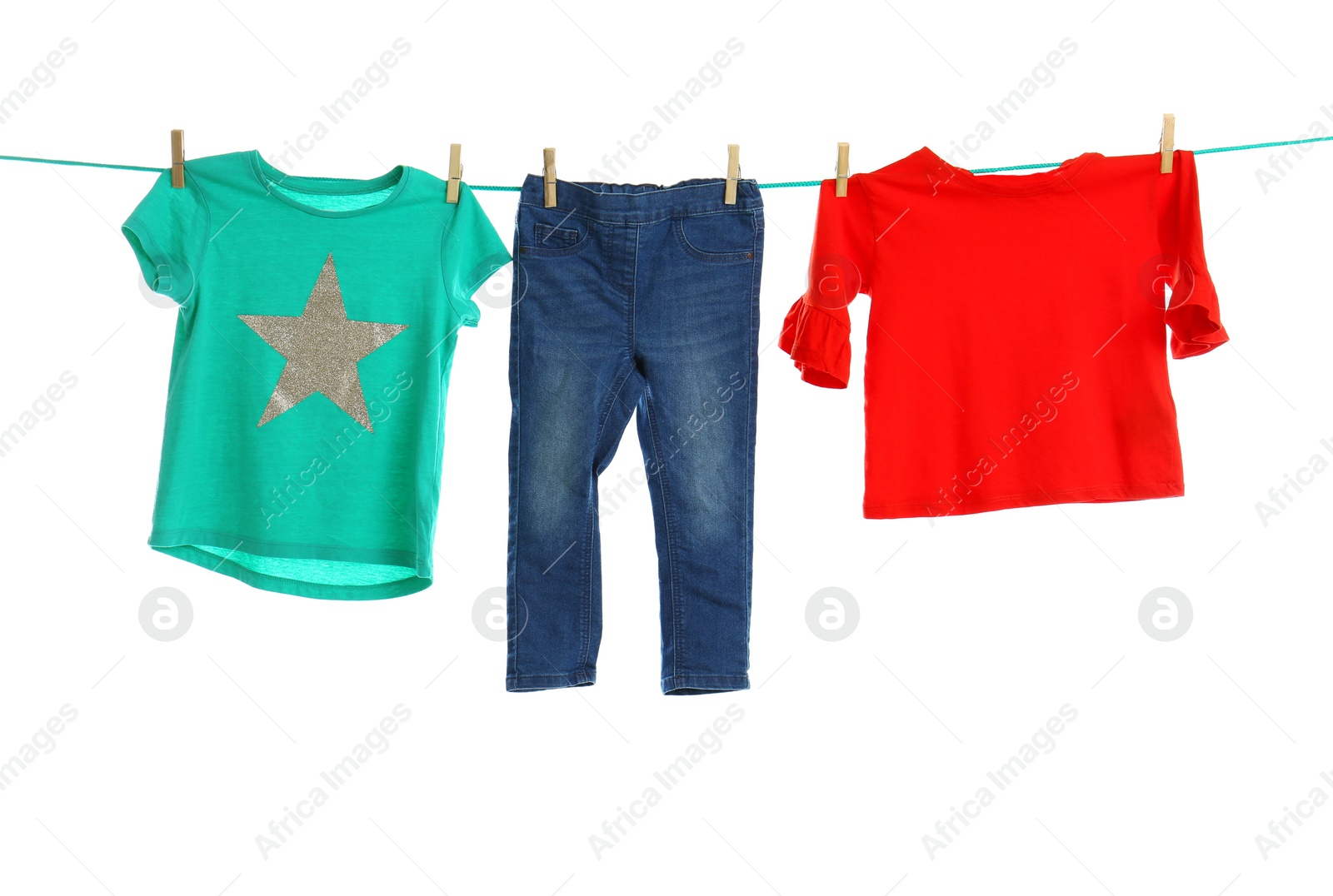 Photo of Child clothes on laundry line against white background