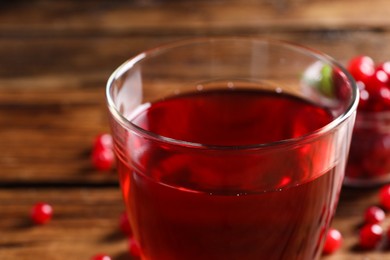 Tasty cranberry juice in glass on table, closeup