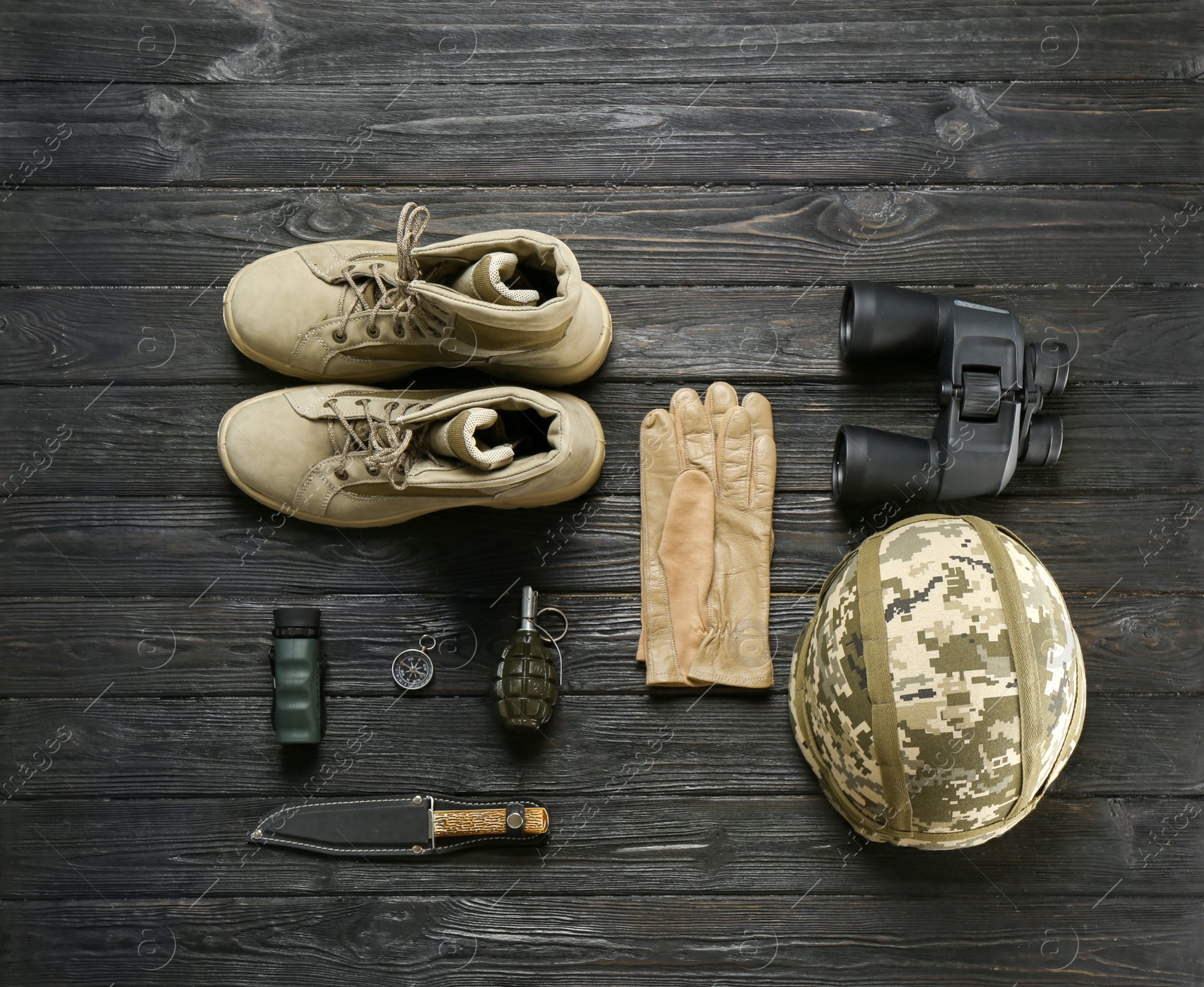 Photo of Set of military equipment and combat boots on wooden background, flat lay