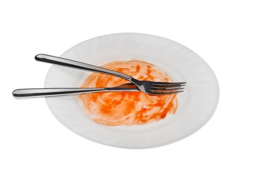 Dirty plate and cutlery on white background