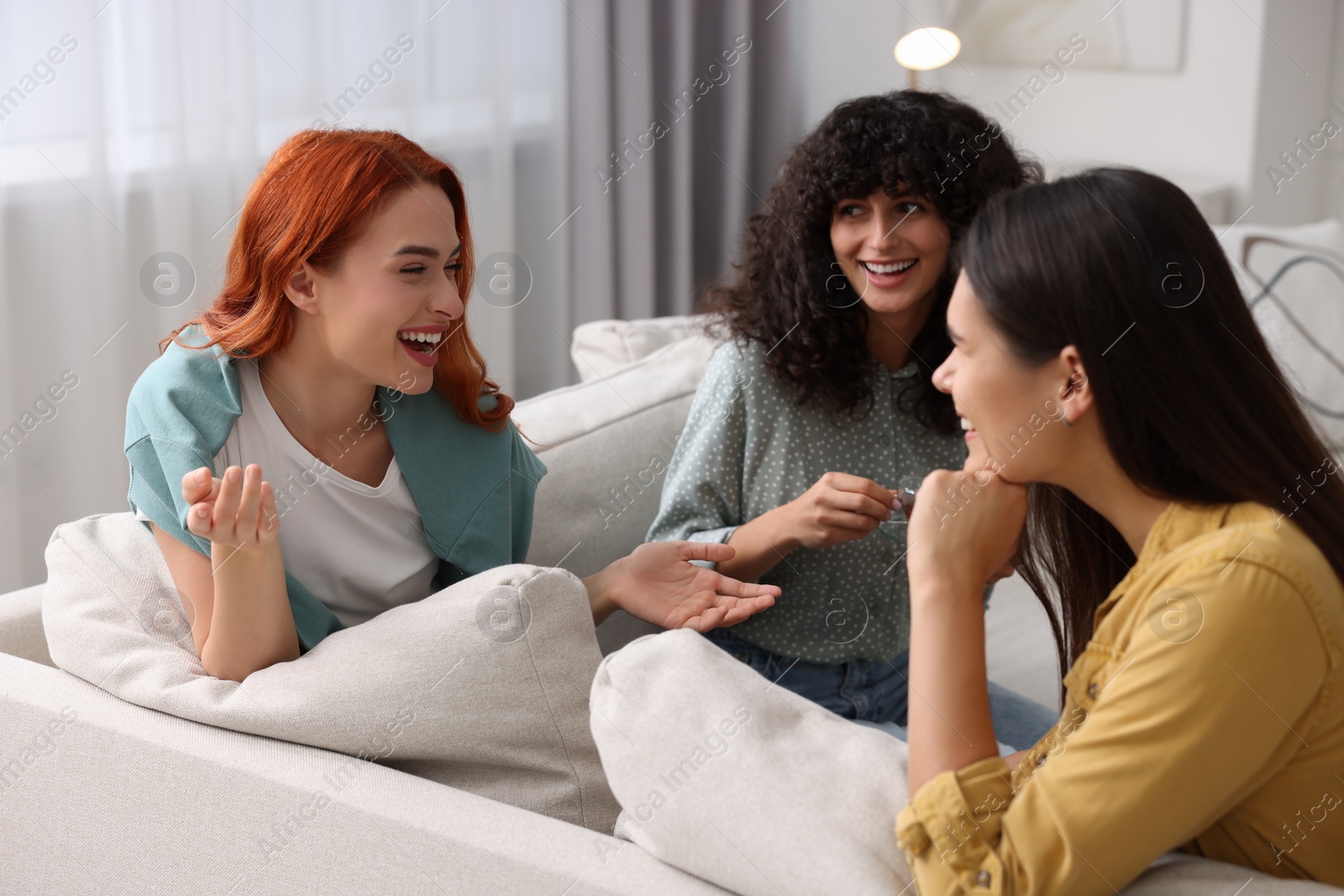 Photo of Happy young friends having fun together at home