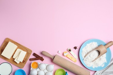 Cooking utensils and ingredients on pink background, flat lay. Space for text