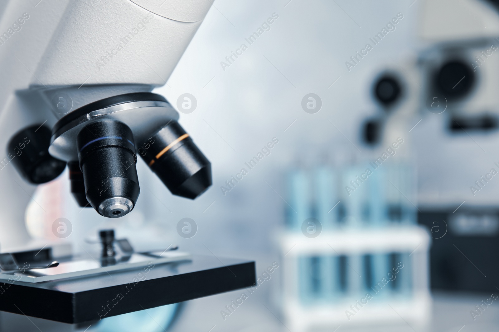 Photo of Closeup view of modern microscope in laboratory, space for text. Medical equipment